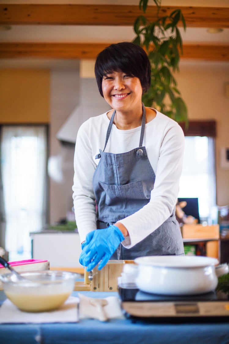 A woman making organic soap at home to sell online